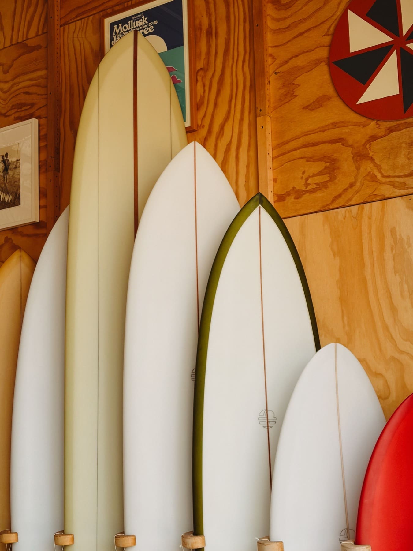 A surfboard rack in a surf shop