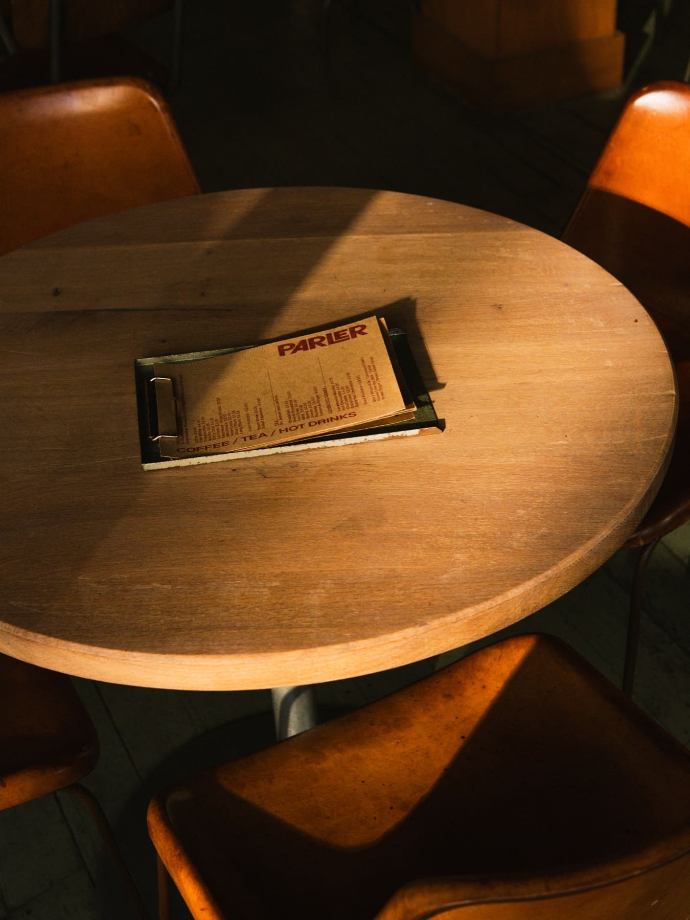 Parler bar table with chairs and a menu