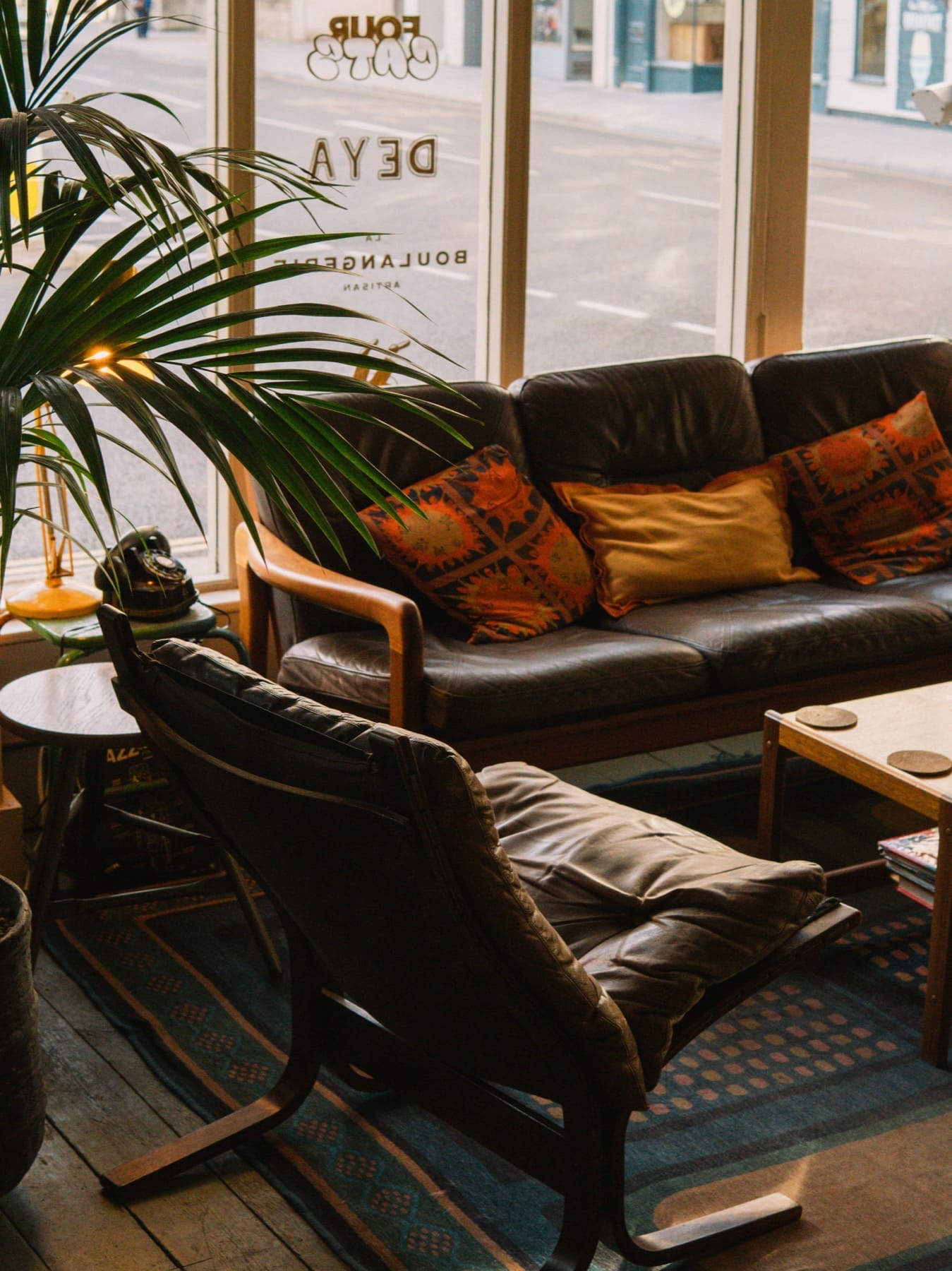 Sofa and chairs next to Parler bar window