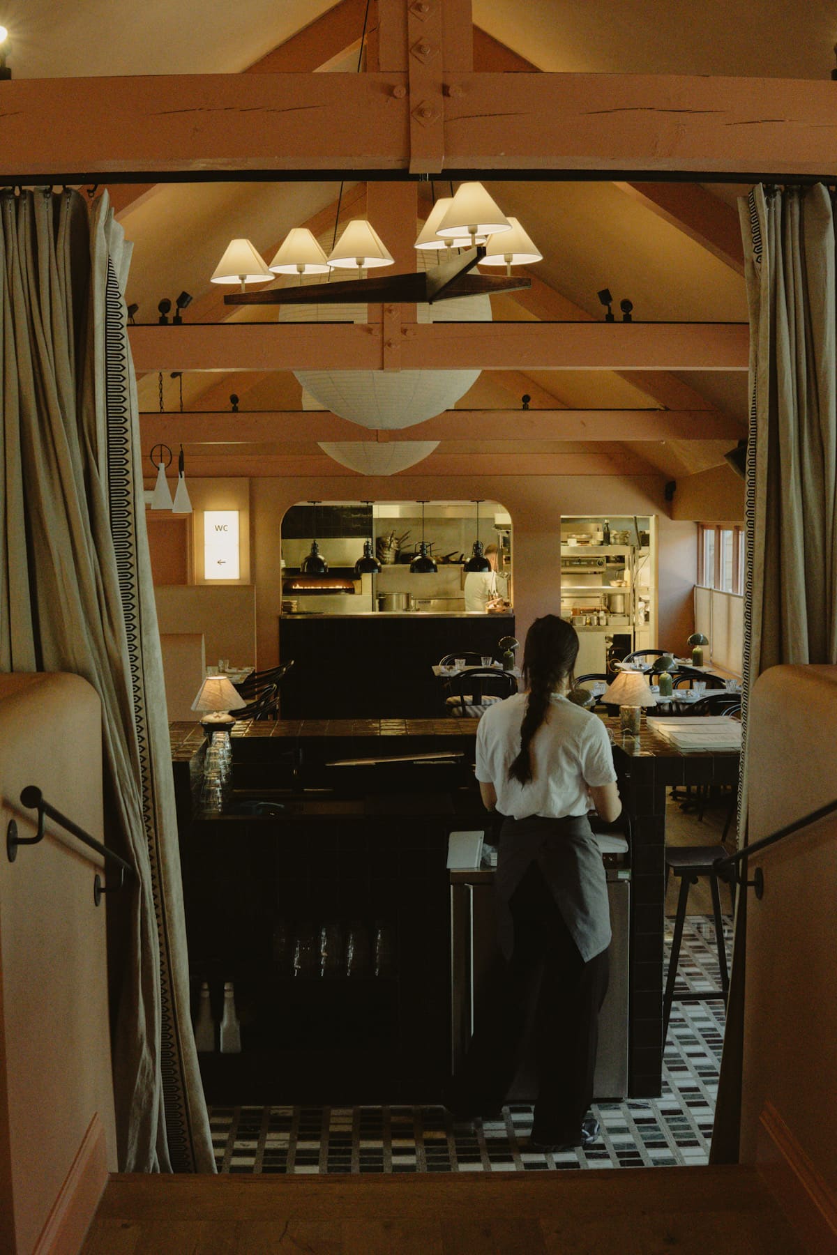 Panoramic view of Lardon restaurant showing one of the staff members