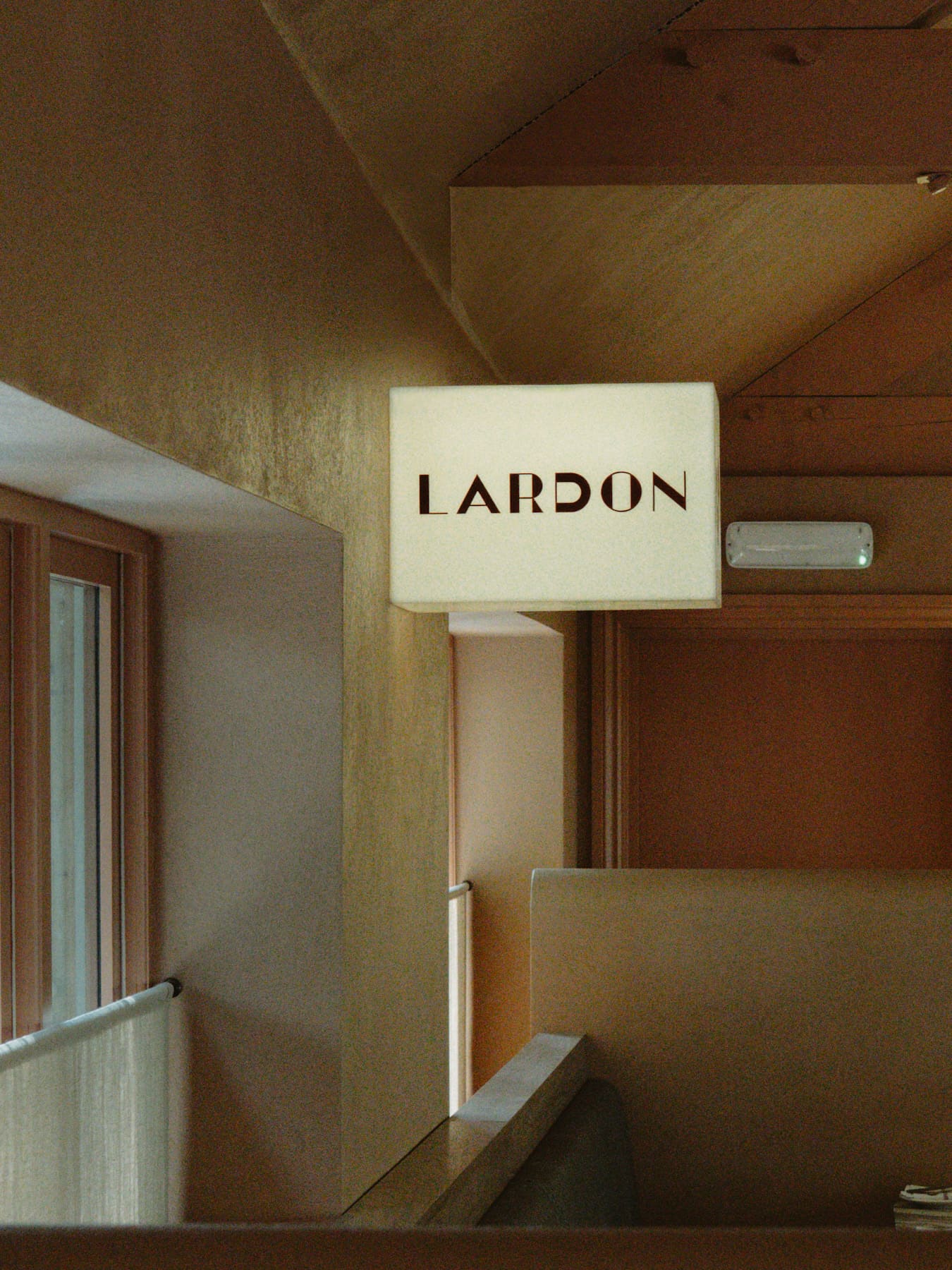 The sign outside Lardon restaurant