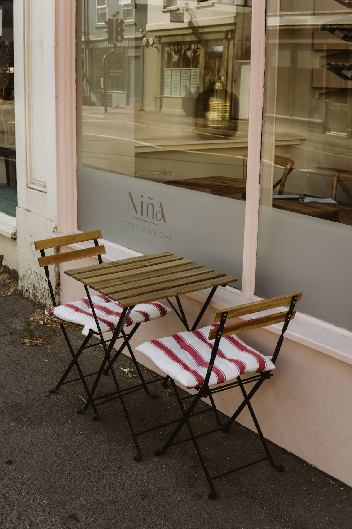 A photo of the outdoor table and chairs at Nina cafe and wine bar